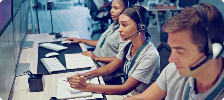 IT Help Desk Team with Headsets Monitoring Systems