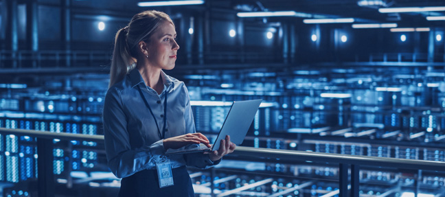 Professional reviewing NOC platform in server room