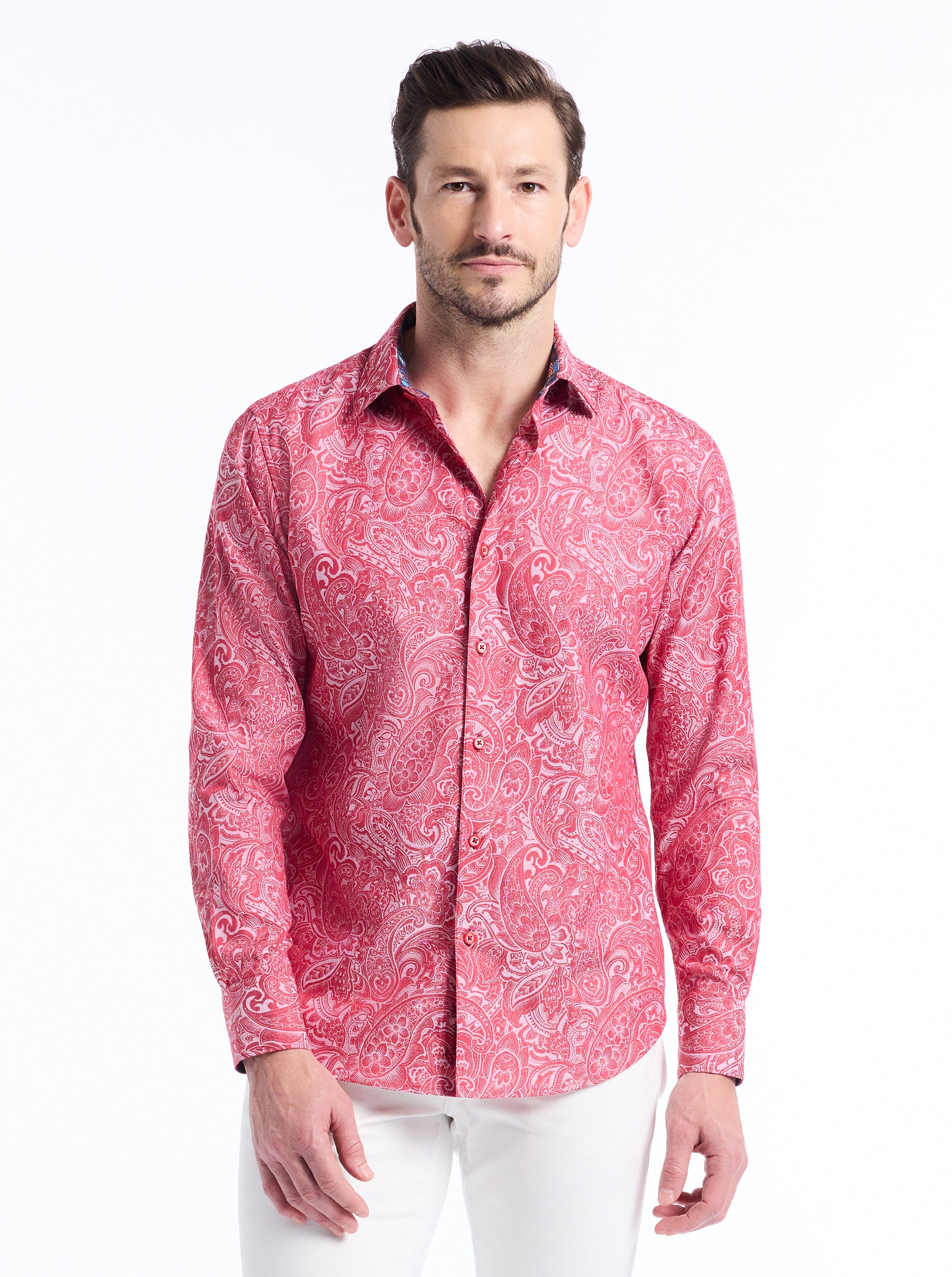 Man wearing a red patterned shirt on a white background